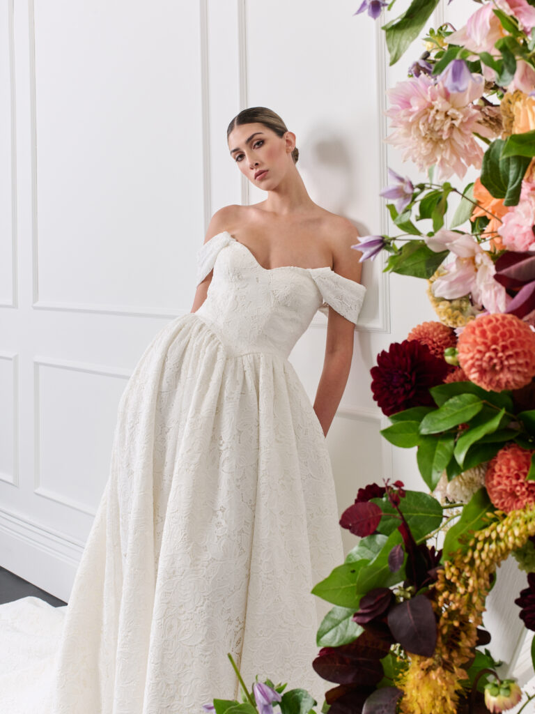 Off shoulder lace strapless cotton lace wedding dress with basque waist, pockets and train