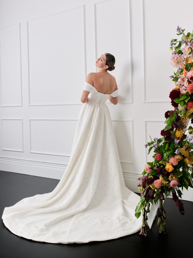 Off shoulder lace strapless cotton lace wedding dress with basque waist, pockets and train