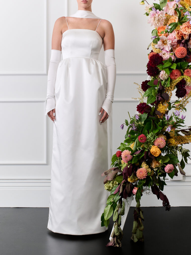 Italian Duchess satin column strapless wedding dress with spaghetti straps, detachable sleeves and spaghetti straps, pocket and slit in the back.