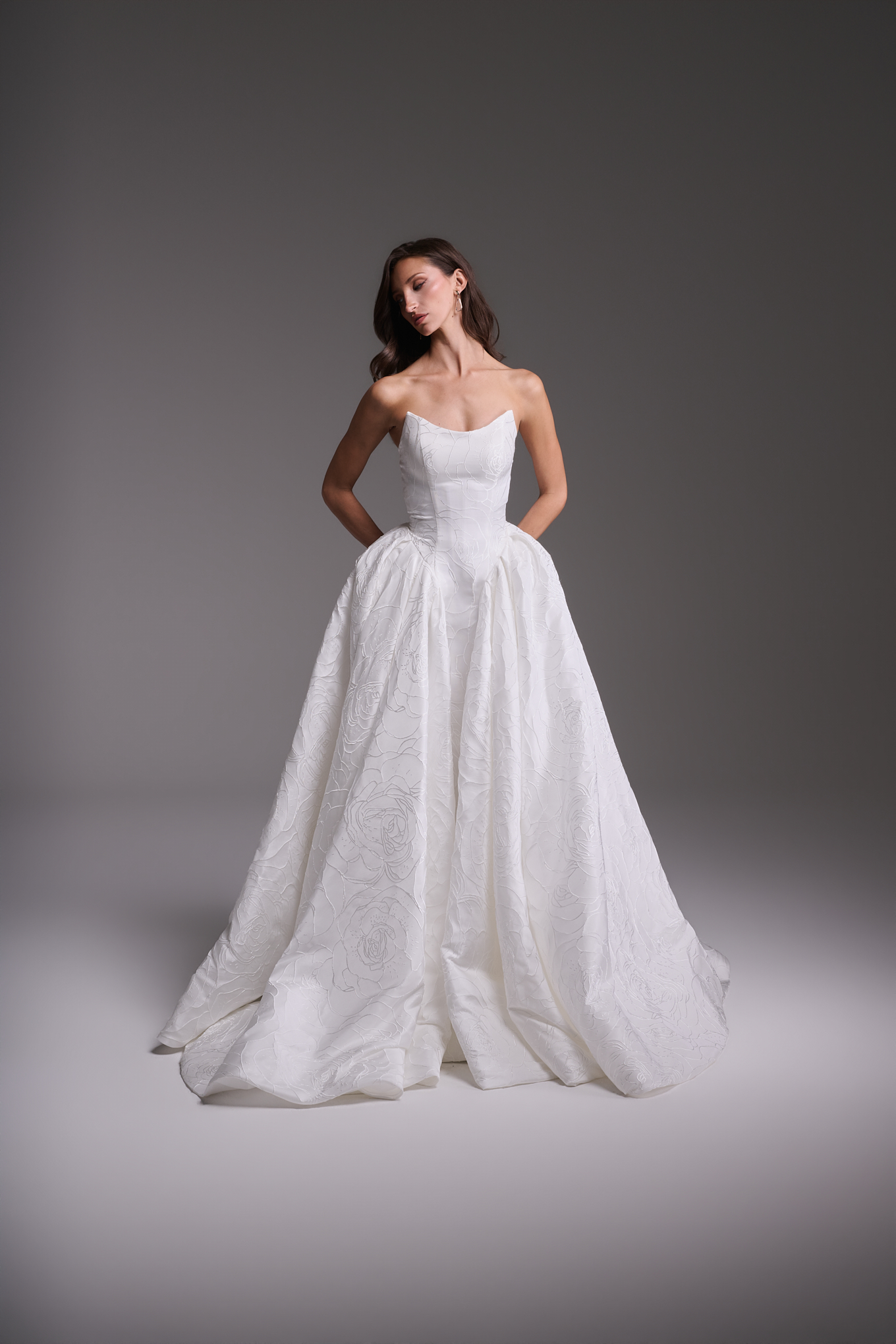 Angela floral jacquard wedding dress by Guillermo Pharis with a strapless neckline, basque waist, and full ball gown skirt